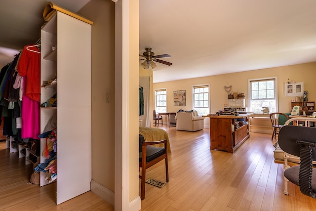 interior space with light hardwood / wood-style floors and ceiling fan