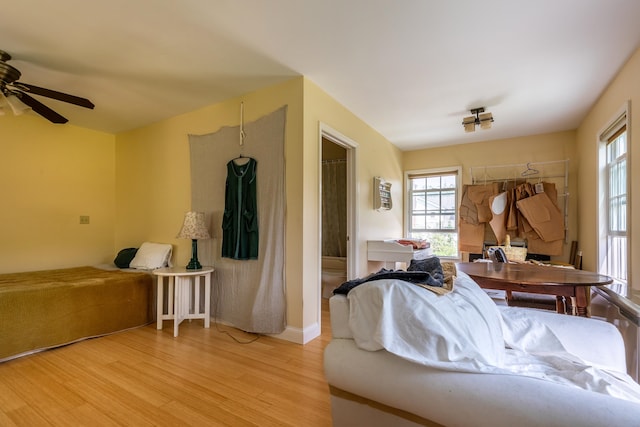 bedroom with light wood-type flooring and ceiling fan