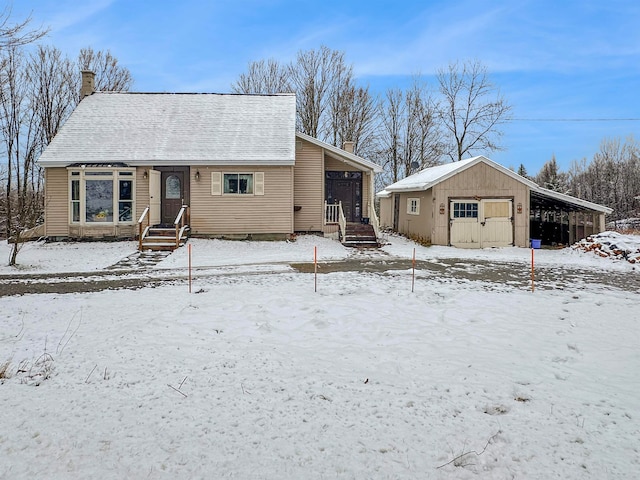 view of front of property featuring an outdoor structure and a carport