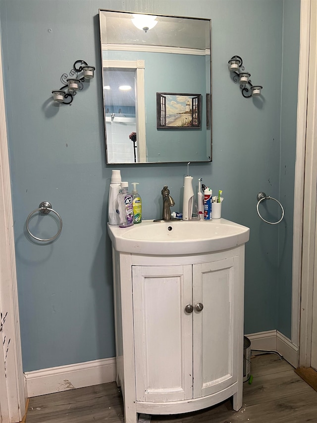 bathroom with vanity and hardwood / wood-style flooring