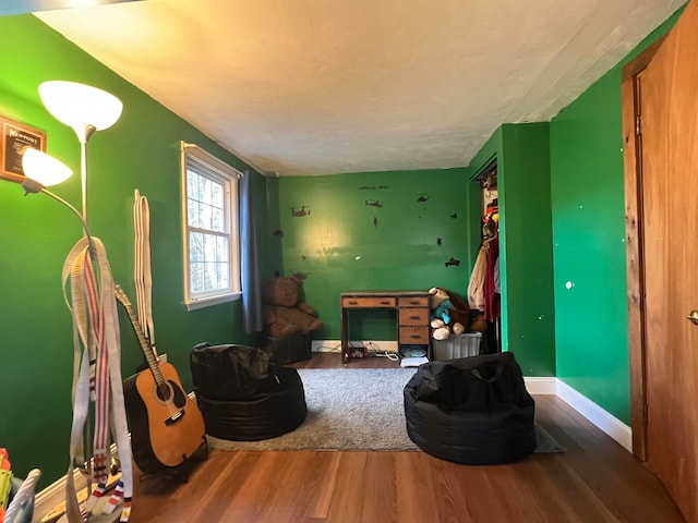 living area with hardwood / wood-style floors