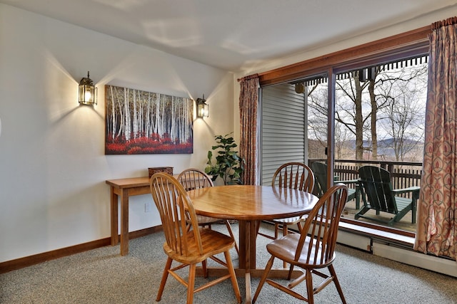 view of carpeted dining area