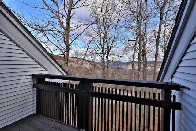 wooden deck with a mountain view