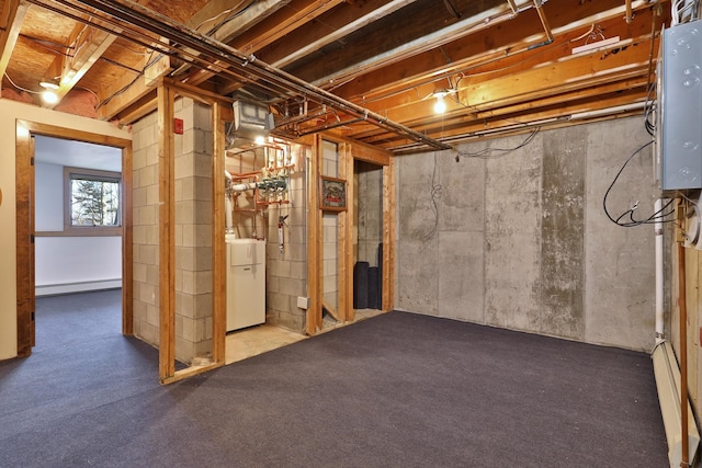 basement featuring washer / clothes dryer, electric panel, and a baseboard radiator