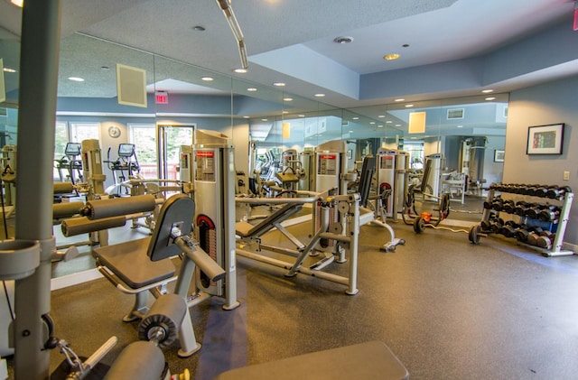 exercise room with a textured ceiling