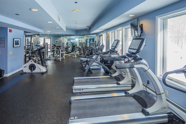 gym with a textured ceiling