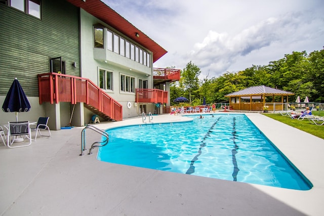 view of pool with a gazebo and a patio