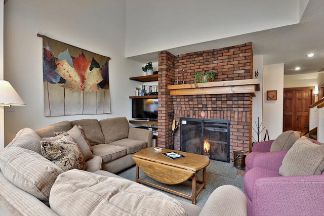 living room featuring a brick fireplace