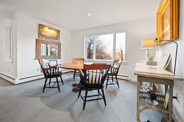 carpeted dining space featuring a baseboard radiator