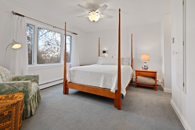 bedroom with carpet, ceiling fan, and a baseboard heating unit