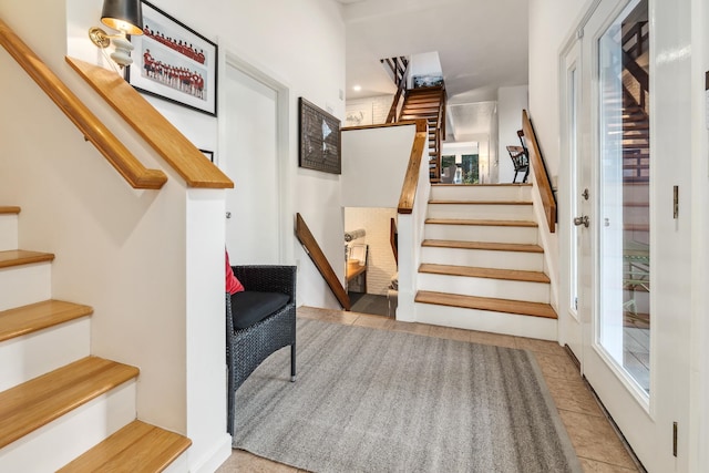 staircase featuring tile patterned flooring