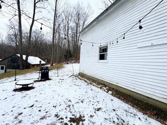 view of yard layered in snow