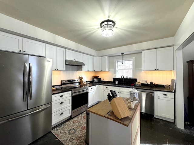 kitchen with white cabinetry, a center island, and stainless steel appliances