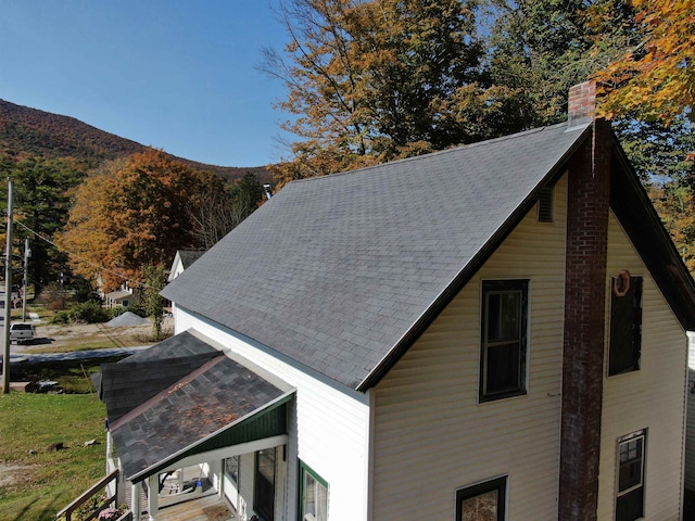 view of home's exterior with a mountain view