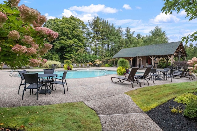 view of swimming pool with a gazebo and a patio