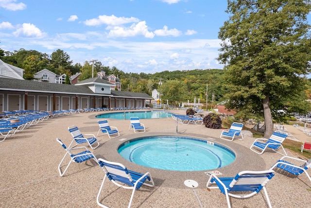 view of swimming pool featuring a patio