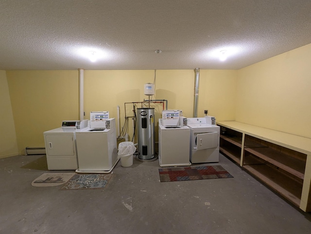 laundry area featuring a textured ceiling, electric water heater, washer and dryer, and a baseboard heating unit