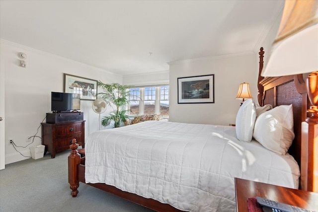 carpeted bedroom featuring crown molding