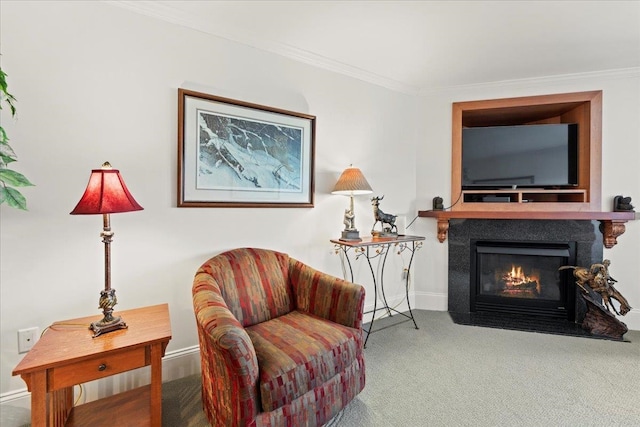 living area with carpet and ornamental molding