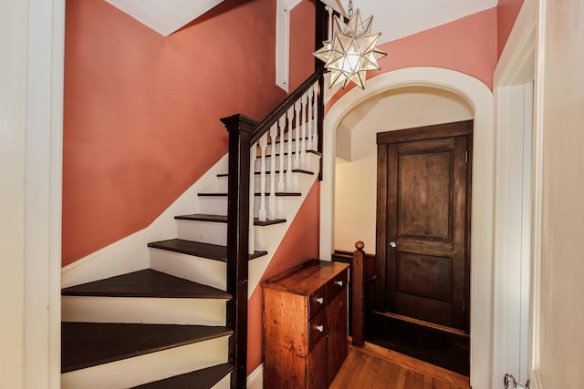 staircase featuring wood-type flooring