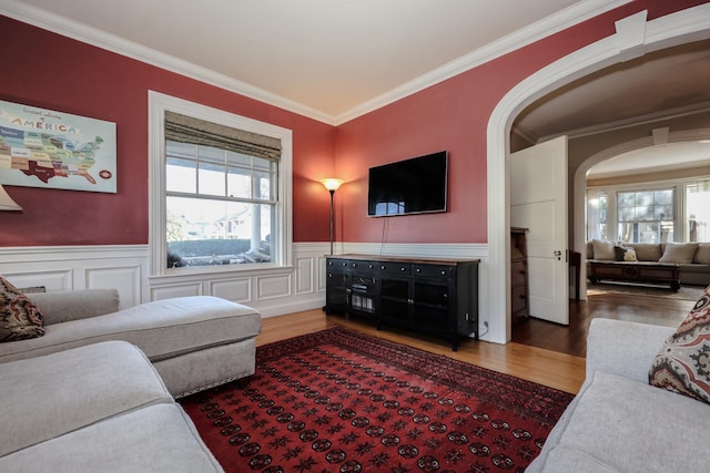 living room featuring ornamental molding and hardwood / wood-style floors