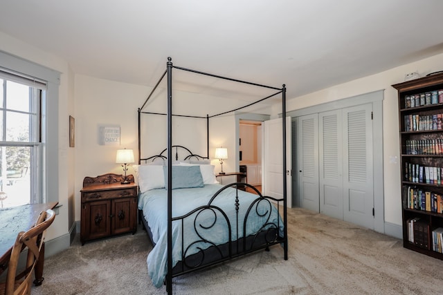 carpeted bedroom with a closet