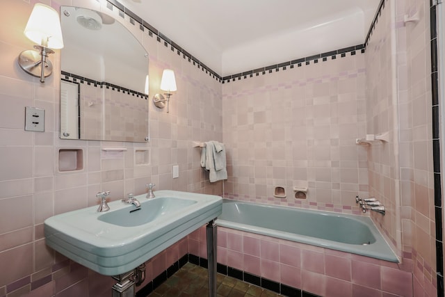 bathroom with tile walls and sink