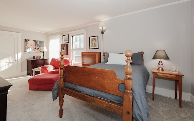 bedroom featuring ornamental molding and carpet flooring