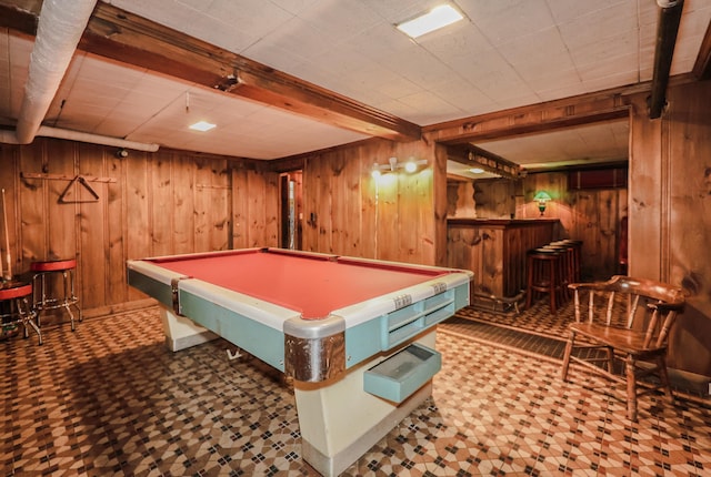 rec room featuring beam ceiling, wooden walls, pool table, and indoor bar