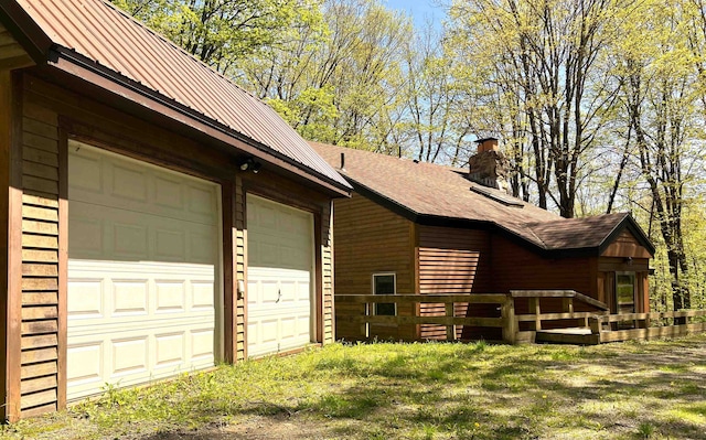 view of property exterior featuring a garage