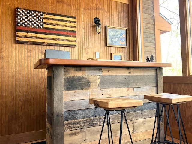 bar featuring wood walls