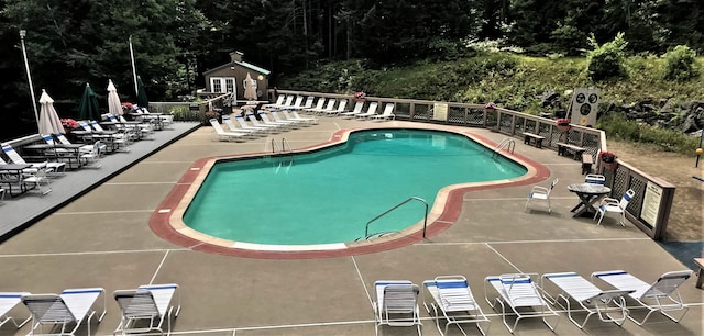 view of swimming pool featuring a patio