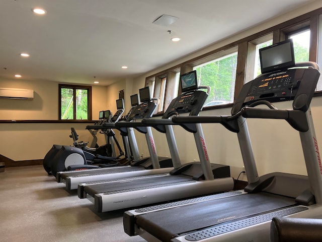 gym featuring a wall mounted air conditioner