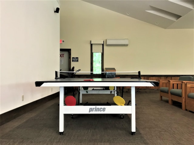 game room featuring an AC wall unit and high vaulted ceiling