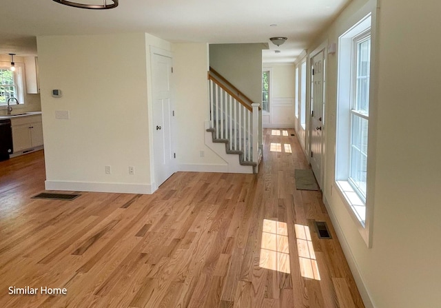 interior space featuring light wood-type flooring and sink