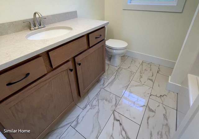 bathroom with vanity and toilet