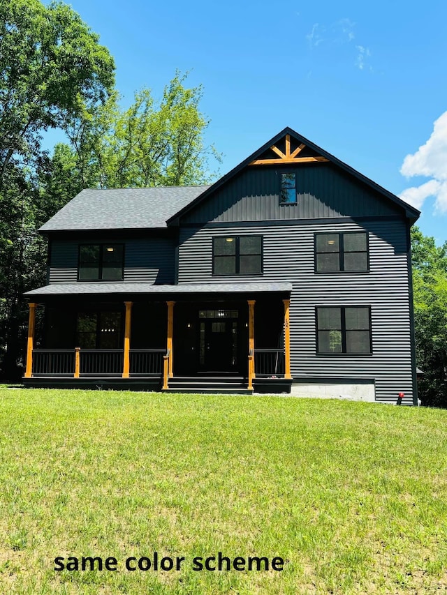 rear view of property with a lawn