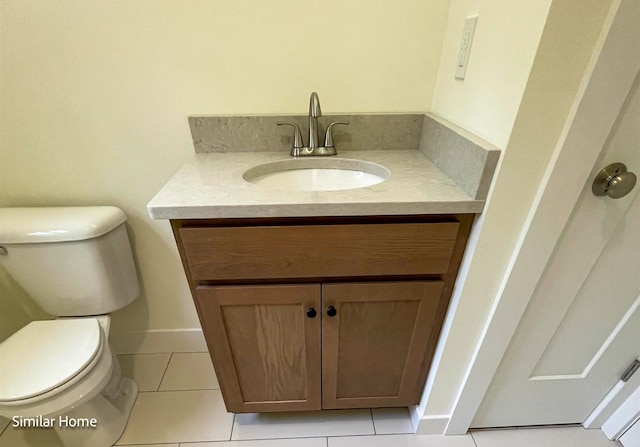 bathroom featuring vanity, toilet, and tile patterned floors