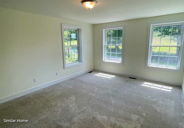 unfurnished room featuring carpet floors