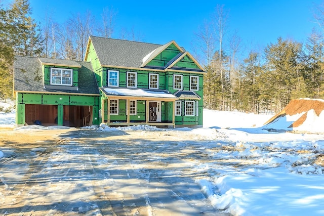 view of front facade with covered porch and driveway