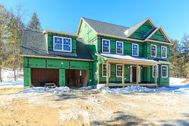 property under construction with a porch and a shingled roof