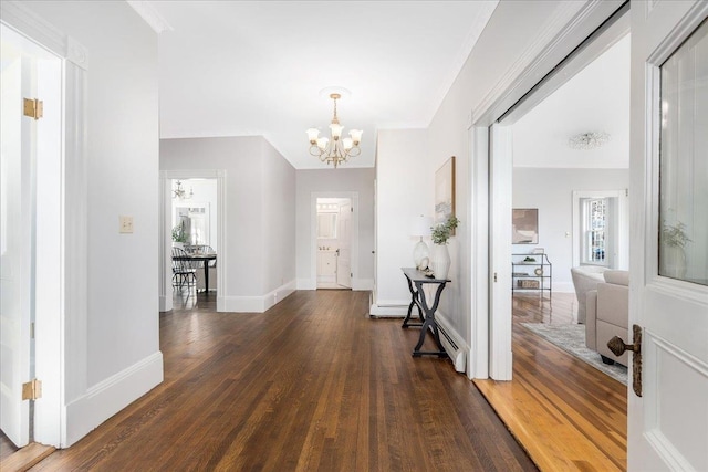 foyer entrance featuring dark hardwood / wood-style floors and an inviting chandelier