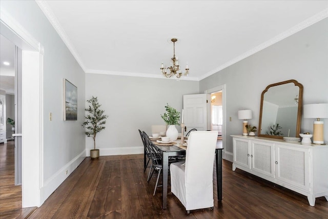 dining space featuring a chandelier, dark hardwood / wood-style floors, and ornamental molding