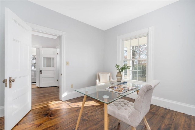 dining area with dark hardwood / wood-style floors