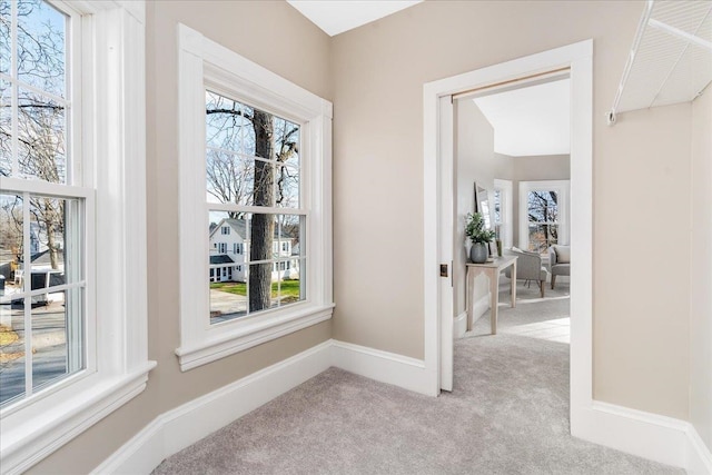 hallway with light carpet