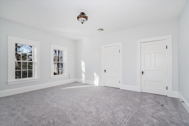 empty room featuring carpet flooring