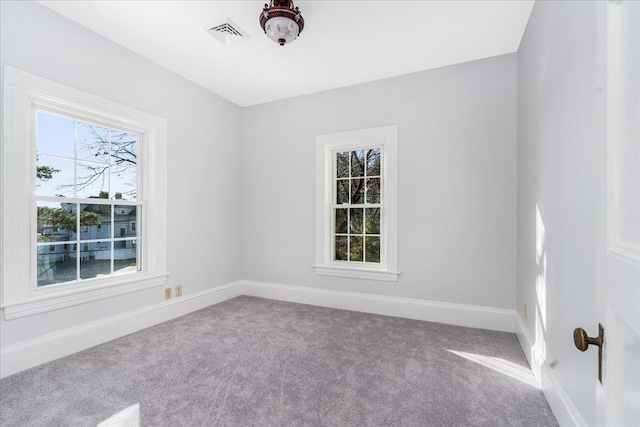 empty room with carpet flooring