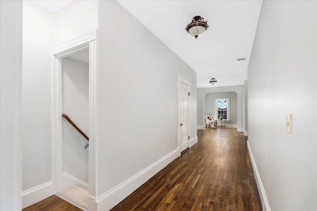 hallway with dark hardwood / wood-style flooring