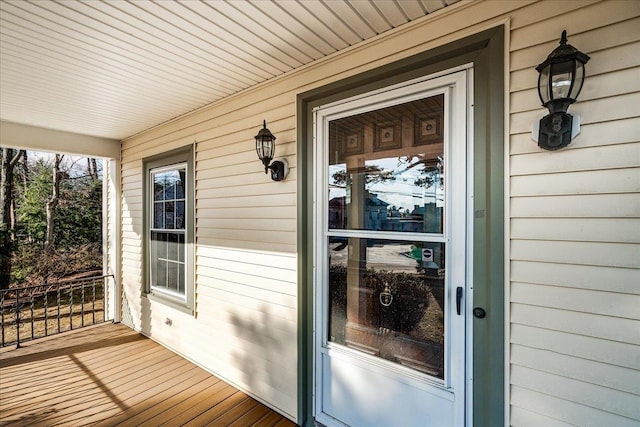 doorway to property featuring covered porch