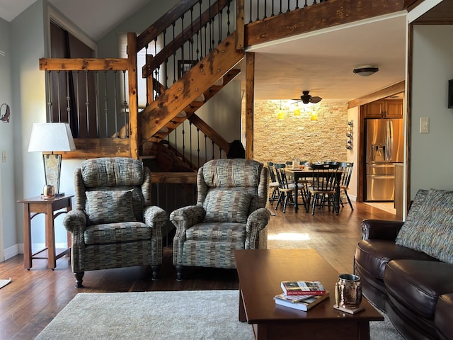 living room featuring lofted ceiling, ceiling fan, and dark hardwood / wood-style floors